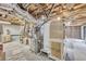 Unfinished basement with exposed ceiling, utilities, and ample storage space at 6338 Boyett Dr, Norcross, GA 30093