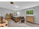 Comfortable bedroom with a window, chair, and dresser, offering a relaxing retreat at 6338 Boyett Dr, Norcross, GA 30093