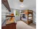 Cozy bedroom featuring a bunk bed, window, and charming decor, perfect for children or guests at 6338 Boyett Dr, Norcross, GA 30093
