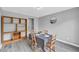 This is a gray dining room featuring a wooden bookcase, and a table with four chairs at 6338 Boyett Dr, Norcross, GA 30093