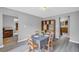 This is a dining room featuring a wooden bookcase and a table with four chairs at 6338 Boyett Dr, Norcross, GA 30093