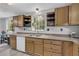 Bright and modern kitchen area featuring wood cabinets, laminate countertops, and stainless-steel sink at 6338 Boyett Dr, Norcross, GA 30093