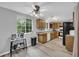 Bright kitchen with stainless steel appliances, light wood cabinets, and a window view to the backyard at 6338 Boyett Dr, Norcross, GA 30093