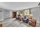 Spacious living room features light gray walls, hard surface flooring, and abundant natural light at 6338 Boyett Dr, Norcross, GA 30093