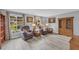 Cozy living room with gray walls, hard surface floors, two chairs, and picture windows at 6338 Boyett Dr, Norcross, GA 30093