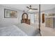 This is a gray main bedroom that features a king-size bed with dark-wood frame and carpeted floors at 6338 Boyett Dr, Norcross, GA 30093