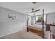 This is a gray main bedroom that features a king-size bed with dark-wood frame, and carpeted floors at 6338 Boyett Dr, Norcross, GA 30093
