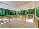 Newly built wooden back deck with backyard views perfect for entertaining and relaxing outdoors at 6965 Kimberland Gardens Ln, Lithonia, GA 30058
