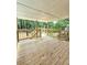 New wooden back deck showcases views of the backyard with lush trees creating a private outdoor space at 6965 Kimberland Gardens Ln, Lithonia, GA 30058