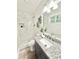 Modern bathroom showcasing granite countertop vanity and a sleek, tiled walk-in shower at 6965 Kimberland Gardens Ln, Lithonia, GA 30058