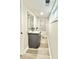Efficient bathroom layout with gray vanity, granite countertop, and modern fixtures at 6965 Kimberland Gardens Ln, Lithonia, GA 30058