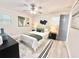 Serene bedroom features a ceiling fan, neutral décor, and comfortable queen-sized bed with stylish accents at 6965 Kimberland Gardens Ln, Lithonia, GA 30058