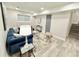 Comfortable living room with stylish decor, a modern sofa, and neutral wall color at 6965 Kimberland Gardens Ln, Lithonia, GA 30058