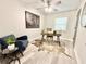 Cozy home office with modern desk, comfortable seating, statement rug and plenty of natural light at 6965 Kimberland Gardens Ln, Lithonia, GA 30058