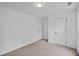 A well-lit bedroom with neutral carpet and two closet doors, ready for personalization at 944 Herndon Nw St, Atlanta, GA 30318