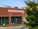 Exterior of King Plow building with green trimmed windows and red brick building at 944 Herndon Nw St, Atlanta, GA 30318