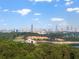 Scenic view of the city skyline from a distance, surrounded by lush greenery and lake at 944 Herndon Nw St, Atlanta, GA 30318