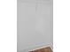 An empty walk-in closet featuring laminate flooring and painted white walls at 944 Herndon Nw St, Atlanta, GA 30318