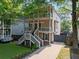 Charming two-story home featuring double porches, a landscaped yard, and a private driveway at 944 Herndon Nw St, Atlanta, GA 30318