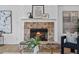 Close up shot of a stone fireplace with mantle and decorative accents at 944 Herndon Nw St, Atlanta, GA 30318