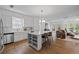 Modern kitchen with stainless steel appliances, a large island, and an open layout for entertaining at 944 Herndon Nw St, Atlanta, GA 30318