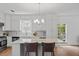 This kitchen is bright and features stainless steel appliances and an island with seating for two at 944 Herndon Nw St, Atlanta, GA 30318