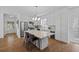 Bright kitchen features stainless steel appliances, a large island with seating and hardwood floors at 944 Herndon Nw St, Atlanta, GA 30318