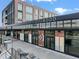 Commercial property featuring large windows, brick facade, and outdoor seating area at 944 Herndon Nw St, Atlanta, GA 30318