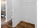 Walk-in closet featuring hardwood floors, fresh paint, and a wire shelf for storage at 944 Herndon Nw St, Atlanta, GA 30318