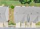 Overhead shot featuring townhome roofs, green lawns, driveways and neighborhood streets at 1936 Lakeshore Overlook Circle Nw Cir, Kennesaw, GA 30152