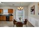 Bright dining area with modern lighting, table for four, and views through the sliding glass doors at 1936 Lakeshore Overlook Circle Nw Cir, Kennesaw, GA 30152