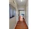 Inviting hallway with gleaming hardwood floors leading to a dining area and other rooms at 1936 Lakeshore Overlook Circle Nw Cir, Kennesaw, GA 30152