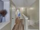 Hallway with hardwood floors, white trim, and a view of the bedroom at 1936 Lakeshore Overlook Circle Nw Cir, Kennesaw, GA 30152
