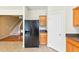 Kitchen with stainless steel refrigerator, tiled floor, and painted door at 1936 Lakeshore Overlook Circle Nw Cir, Kennesaw, GA 30152
