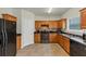 Functional kitchen with stainless steel appliances, ample counter space, and tiled flooring at 1936 Lakeshore Overlook Circle Nw Cir, Kennesaw, GA 30152