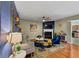 Cozy living room featuring a fireplace, plush seating, hardwood floors, and stylish decor at 1936 Lakeshore Overlook Circle Nw Cir, Kennesaw, GA 30152