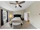 Bright bedroom with large windows, ceiling fan, ensuite bathroom, and walk-in closet at 1936 Lakeshore Overlook Circle Nw Cir, Kennesaw, GA 30152