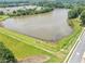 Scenic view of a serene lake in a beautiful community, showcasing green shores and natural beauty at 1936 Lakeshore Overlook Circle Nw Cir, Kennesaw, GA 30152