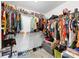Spacious walk-in closet with extensive shelving, racks, and ample storage space for shoes and clothing at 1936 Lakeshore Overlook Circle Nw Cir, Kennesaw, GA 30152