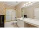 Bright bathroom features a shower-tub combination, wide countertops, and wallpaper at 2145 Sugarstone Ct, Lawrenceville, GA 30043