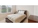 Bedroom with neutral paint, carpet, good lighting and a large window at 2145 Sugarstone Ct, Lawrenceville, GA 30043