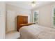 Cozy bedroom with neutral colors and natural light from windows at 2145 Sugarstone Ct, Lawrenceville, GA 30043