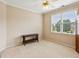 Neutral bedroom with two windows, ceiling fan, and trim at 2145 Sugarstone Ct, Lawrenceville, GA 30043