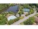 Aerial shot features a community pool, tennis courts and a picturesque lake at 2145 Sugarstone Ct, Lawrenceville, GA 30043