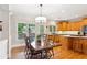 Dining room with windows and chandelier at 2145 Sugarstone Ct, Lawrenceville, GA 30043