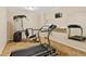 Exercise room featuring treadmill and weight machine at 2145 Sugarstone Ct, Lawrenceville, GA 30043