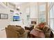 Cozy living room with fireplace, large windows, and built-in shelving at 2145 Sugarstone Ct, Lawrenceville, GA 30043