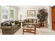 Cozy living room with comfortable seating and a bright window at 2145 Sugarstone Ct, Lawrenceville, GA 30043