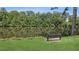 Relax and enjoy the calming water views from a bench overlooking a lush pond at 2145 Sugarstone Ct, Lawrenceville, GA 30043