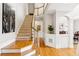Elegant staircase with carpeted steps and wood railings leading to the second floor at 2145 Sugarstone Ct, Lawrenceville, GA 30043